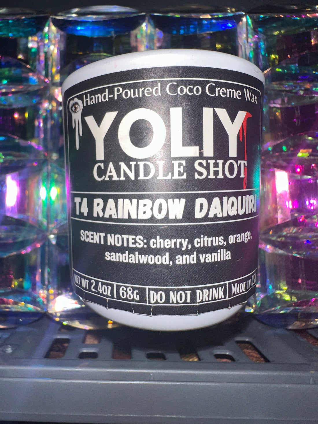 YOLIY "T4 Rainbow Daiquiri" Candle Shot in a black matte vessel. Fruity cereal-inspired candle with cherry citrus, orange, vanilla, and sandalwood. 